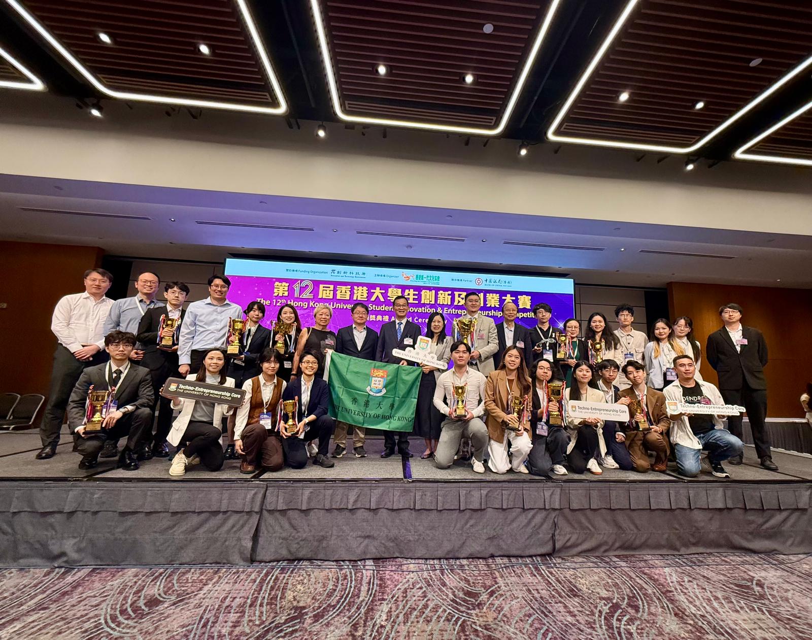 Fly Fly Check team on stage at the 12th Hong Kong University Student Innovation and Entrepreneurship Competition